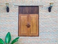 Facade of Old Building brick wall with Wooden Window Lantern and leaf Royalty Free Stock Photo