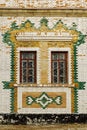 The facade of an old building is faced with glazed bricks Royalty Free Stock Photo