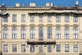 Facade of an old building with large windows and dilapidated walls Royalty Free Stock Photo