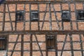 Facade of an old building with red bricks and wooden beams Royalty Free Stock Photo