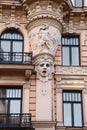 Facade of old building with sculptures - woman heads in Art Nouveau style Jugendstil Royalty Free Stock Photo