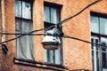 Facade of an old building in St. Petersburg and an old lantern on wires. Royalty Free Stock Photo