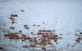 The facade of an old building. Texture of a red brick wall. Background painted with cracked white paint Royalty Free Stock Photo