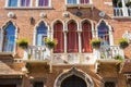 Facade with Venetian windows and balkony in Venice Royalty Free Stock Photo