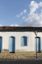 Facade of an old colonial house in central Brazil.Traditional house in Pirenopolis, window historic Brazil, lamppost. Royalty Free Stock Photo