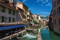 Facade of old and colorful buildings facing the canal in Annecy. Royalty Free Stock Photo