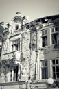 Facade of old destroyed house with broken windows Royalty Free Stock Photo