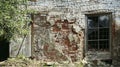 The facade of an old dilapidated house is cracked brickwork Royalty Free Stock Photo
