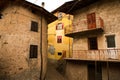 Facade of the old European house. Facade of old houses and stone staircase in Italy. Medieval house and door. Royalty Free Stock Photo