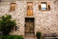 Facade of the old European house. Facade of old houses and stone staircase in Italy. Medieval house and door. Royalty Free Stock Photo