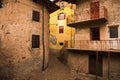 Facade of the old European house. Facade of old houses and stone staircase in Italy. Medieval house and door.