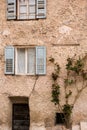 Facade of the old European house. Facade of old houses and stone staircase in Italy. Medieval house and door. Royalty Free Stock Photo