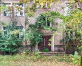 Facade of an old German building with dense vegetation