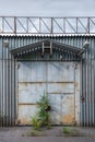 The facade of an old gray metal hangar Royalty Free Stock Photo