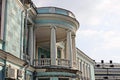 Facade of an old historic building with a blue wall and an open concrete balcony Royalty Free Stock Photo