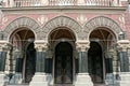 Facade of an old historic building with marble columns and a concrete wall Royalty Free Stock Photo