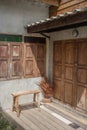 Facade of an old house with vintage suitcases near the doo