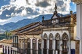 Facade of old houses built in colonial architecture with their balconies Royalty Free Stock Photo