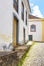 Facade of old houses built in colonial architecture with their balconies, roofs and colorful details Royalty Free Stock Photo