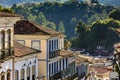 Facade of old houses built in colonial architecture with their balconies and roofs Royalty Free Stock Photo