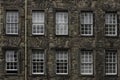 A facade of an old palace with 2 rows of windows in Edinburgh old town Royalty Free Stock Photo