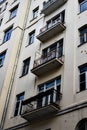 facade of old residential building with balconys and drainpipe