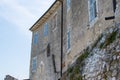 Facade of an old ruined house on a stone wall in the old town of Porec Parenzo, in the Istrian Peninsula, Croatia Royalty Free Stock Photo