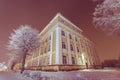 Facade of old school building. Winter landscape. Night. Royalty Free Stock Photo