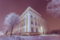 Facade of old school building. Winter landscape. Night. Royalty Free Stock Photo