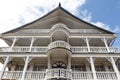 Facade of an old white wooden house with balconies in the historic center of Paramaribo, Suriname Royalty Free Stock Photo