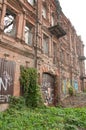 Facade of an old wooden dilapidated house with modern graffiti Royalty Free Stock Photo