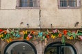 Facade of one traditional Alsatian house with cheerful decorations, Colmar, France