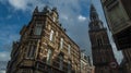 facade of a palace and a steeple in amsterdam downtown