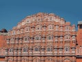 Facade of the Palace of Winds against the clear summer sky, Jaipur, India Royalty Free Stock Photo