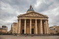 Facade of the Pantheon in Neoclassical style, with dome and columns at the entrance in Paris.