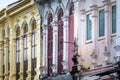 Facade perspective of ancient buildings. Colorful facade, arched windows in antique style.