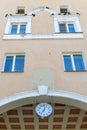 Facade withwindows, cloc and pigeons