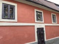 Facade of pink historic house in Golden Lane, Prague, Czech Republic Royalty Free Stock Photo