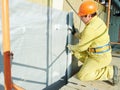 Facade Plasterer at exterior insulation work Royalty Free Stock Photo
