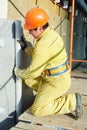 Facade Plasterer at exterior insulation work Royalty Free Stock Photo
