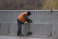 Facade plasterer sealing joint of building wall with putty.