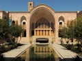 Facade, pool and wind tower of Kashan traditional palace