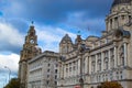 Facade of Port of Liverpool Building or Dock Office with the tower of the Royal Liver Building at the background in Pier Head,