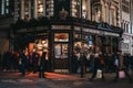 Facade of Red Lion pub in Shoreditch, London, UK, people in front, motion blur