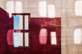 Facade of a red-yellow building with reflections from the windows of the neighboring building. the single window reflects the corn Royalty Free Stock Photo