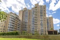 Facade of a residential multi-storey building and a courtyard in the center of Moscow on a spring day