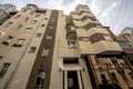 Facade of a residential multi-storey building and a courtyard in the center of Moscow on a spring day