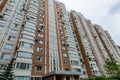 Facade of a residential multi-storey building and a courtyard in the center of Moscow on a spring day