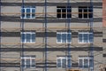 Facade restoration work. Scaffolding in front of the facade. Building under construction with scaffolds. construction Royalty Free Stock Photo