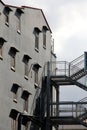 The facade of a restored building, with safety stairs